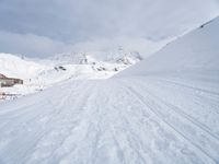 Straight Down the Road: A View of the Alps' Majestic Mountains