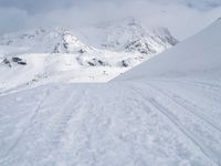 Straight Down the Road: A View of the Alps' Majestic Mountains