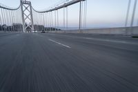 Straight Down the Road at Dawn: Asphalt and Clear Sky