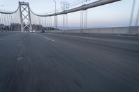 Straight Down the Road at Dawn: Asphalt and Clear Sky