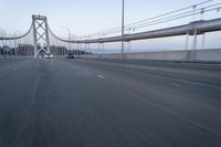 Straight Down the Road at Dawn: Asphalt and Clear Sky