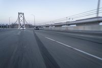 Straight Down the Road at Dawn: Asphalt and Clear Sky