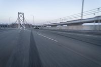 Straight Down the Road at Dawn: Asphalt and Clear Sky