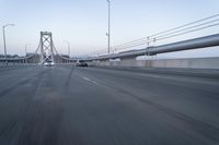 Straight Down the Road at Dawn: Asphalt and Clear Sky