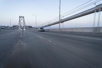 Straight Down the Road at Dawn: Asphalt and Clear Sky