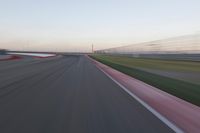 Straight Down the Road: POV of a Field Surrounded by Lines