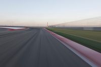 Straight Down the Road: POV of a Field Surrounded by Lines