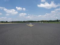 an arrow painted on the runway to indicate how far away you may be coming from it