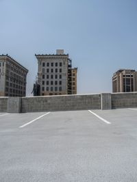 a parking lot and wall are pictured in a photo from the perspective point of view