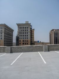 a parking lot and wall are pictured in a photo from the perspective point of view