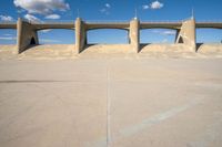 the two bridge are separated by two concrete pillars with an area for vehicles to pass