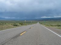 Straight Road Under a Gloomy Grey Sky in Colorado