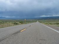 Straight Road Under a Gloomy Grey Sky in Colorado