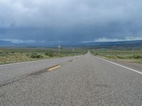 Straight Road Under a Gloomy Grey Sky in Colorado