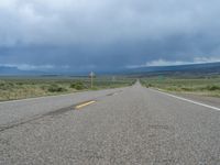 Straight Road Under a Gloomy Grey Sky in Colorado