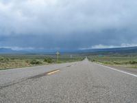 Straight Road Under a Gloomy Grey Sky in Colorado