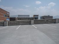 a parking lot and wall are pictured in a photo from the perspective point of view