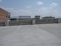 a parking lot and wall are pictured in a photo from the perspective point of view