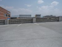 a parking lot and wall are pictured in a photo from the perspective point of view