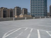 a parking lot and wall are pictured in a photo from the perspective point of view