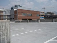 a parking lot and wall are pictured in a photo from the perspective point of view