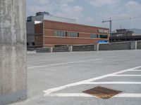 a parking lot and wall are pictured in a photo from the perspective point of view