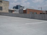 a parking lot and wall are pictured in a photo from the perspective point of view