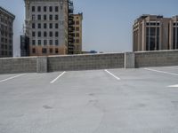 a parking lot and wall are pictured in a photo from the perspective point of view