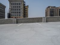 a parking lot and wall are pictured in a photo from the perspective point of view