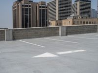 a parking lot and wall are pictured in a photo from the perspective point of view