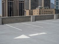 a parking lot and wall are pictured in a photo from the perspective point of view