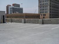 a parking lot and wall are pictured in a photo from the perspective point of view