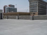 a parking lot and wall are pictured in a photo from the perspective point of view