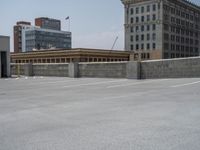 a parking lot and wall are pictured in a photo from the perspective point of view