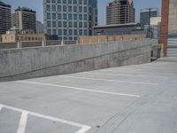 a parking lot and wall are pictured in a photo from the perspective point of view