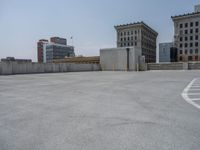 a parking lot and wall are pictured in a photo from the perspective point of view