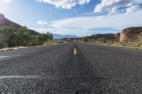 the empty highway has an extremely wide bend for riding around it - no other traffic