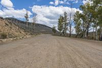Straight Road through Mountain Landforms in a Rural Wilderness
