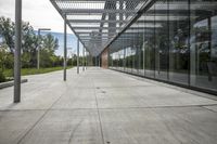 a walkway with a lot of glass walls to keep people out from the sun or on the road