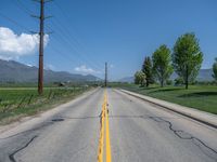 Straight Road in Rural Utah: Asphalt and Snow