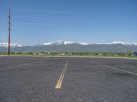 Straight Road in Rural Utah: Snow-Covered Fields