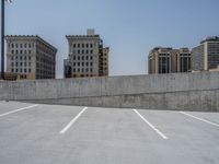 a parking lot and wall are pictured in a photo from the perspective point of view