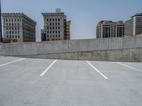 a parking lot and wall are pictured in a photo from the perspective point of view