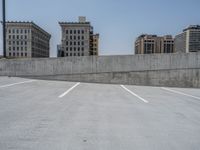 a parking lot and wall are pictured in a photo from the perspective point of view