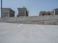 a parking lot and wall are pictured in a photo from the perspective point of view