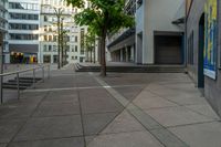 a street view with steps and trees with building in the background in front of it