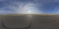 fisheye lens image with wide angle lens on asphalt field in open landscaped area