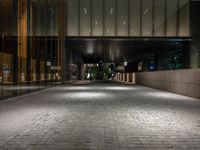 an open door at the lobby of a modern building with glass doors on either side