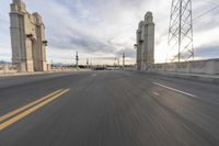 a freeway is seen from behind the car on a cloudy day, with no traffic or cars