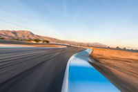 Straight Road in the USA at Dawn: Witnessing the Clouds